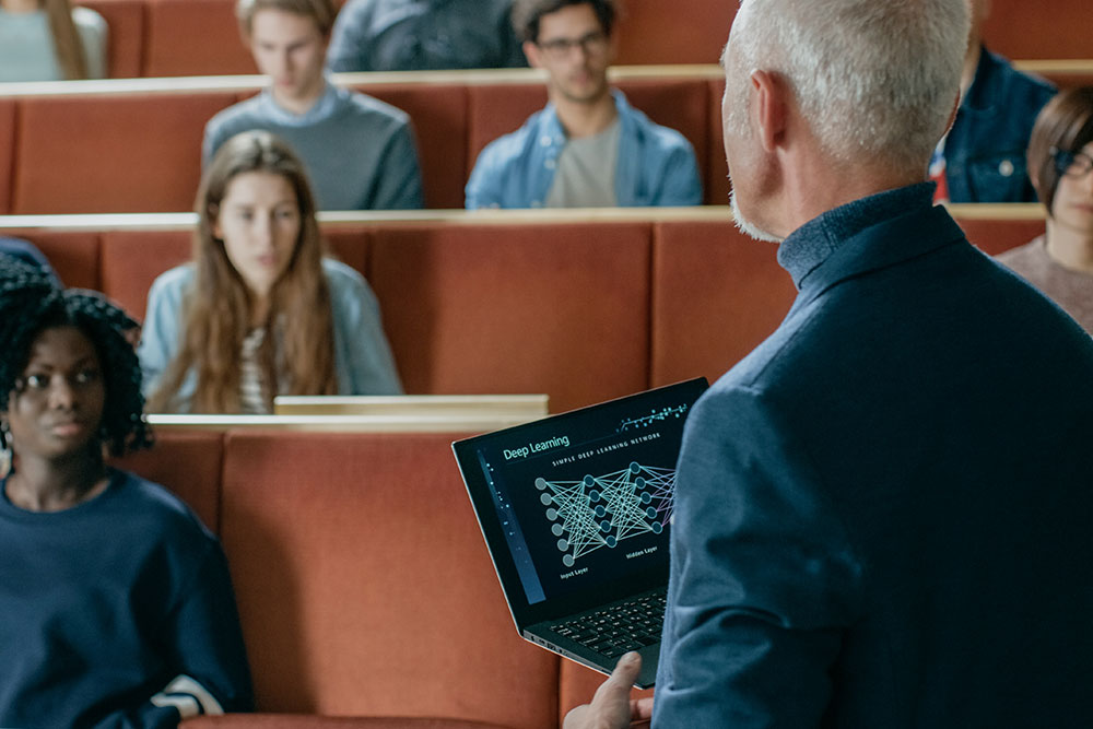 A group of university students engaged in a supportive discussion about mental health and wellbeing.